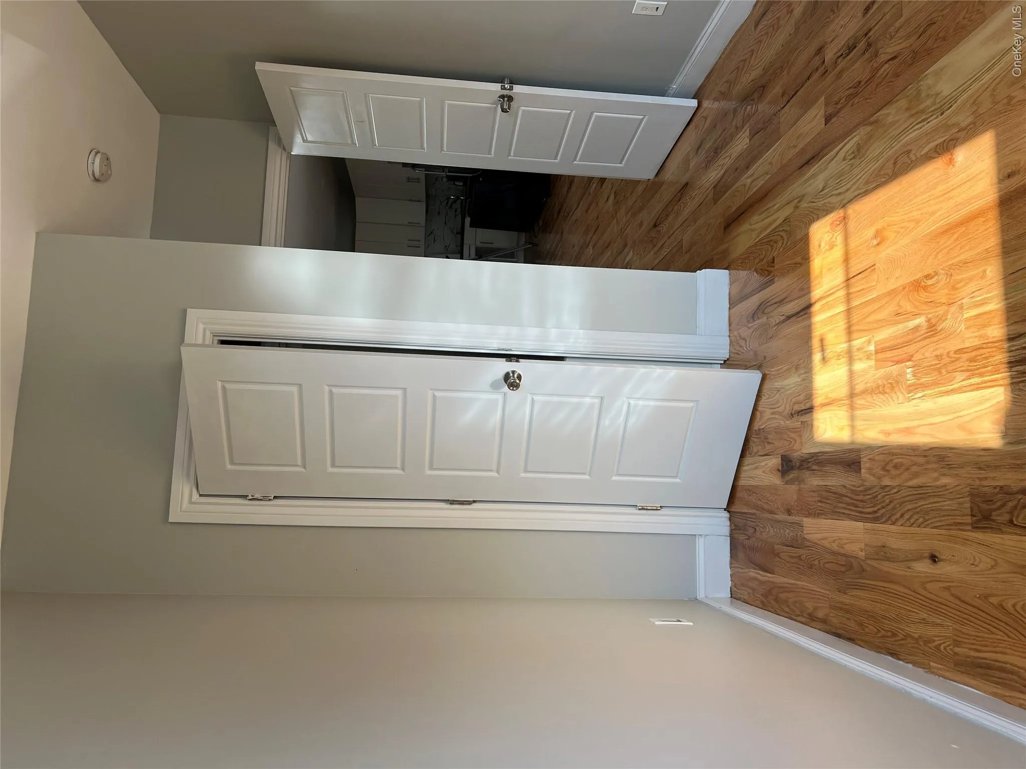 Hardwood flooring, paneled interior doors, and light neutral wall finishes Hardwood flooring, paneled interior doors, and light neutral wall finishes