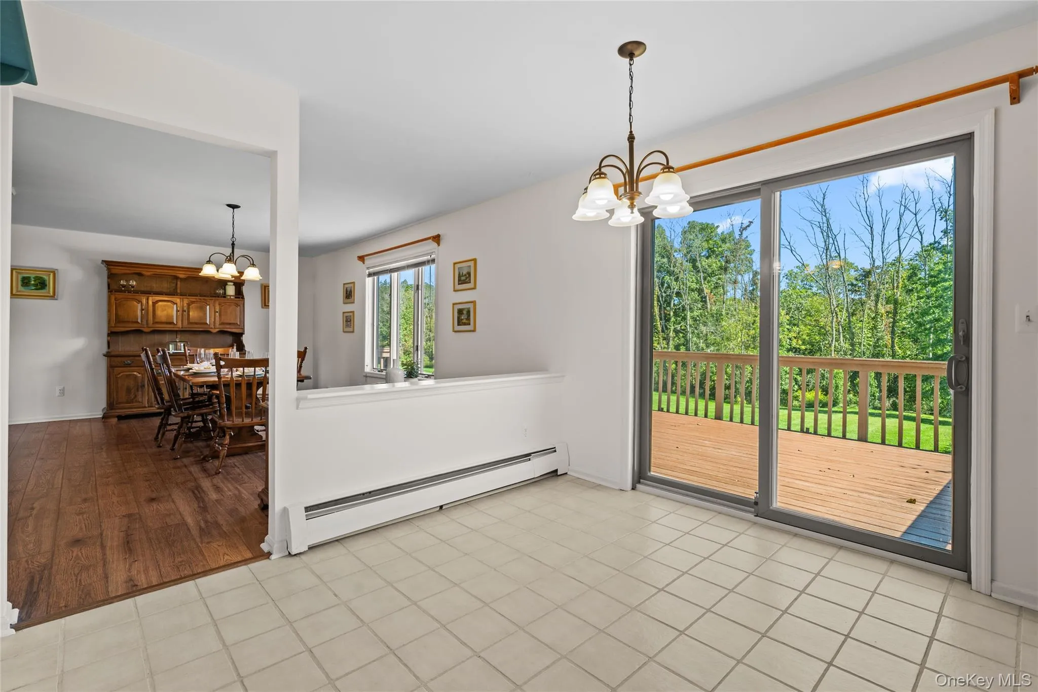 Sliding Door leads to oversized wooden deck Sliding Door leads to oversized wooden deck