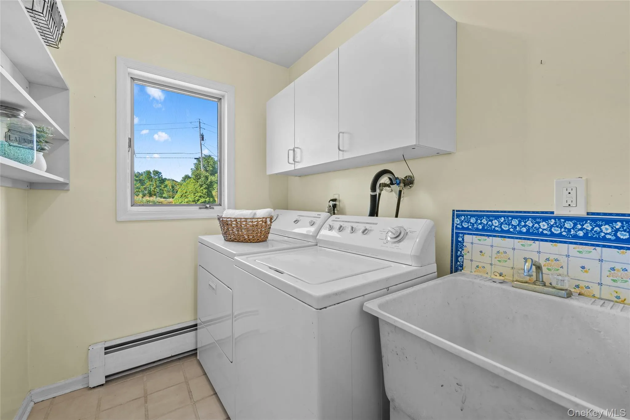 with slop sink and cabinetry - Main Floor with slop sink and cabinetry - Main Floor