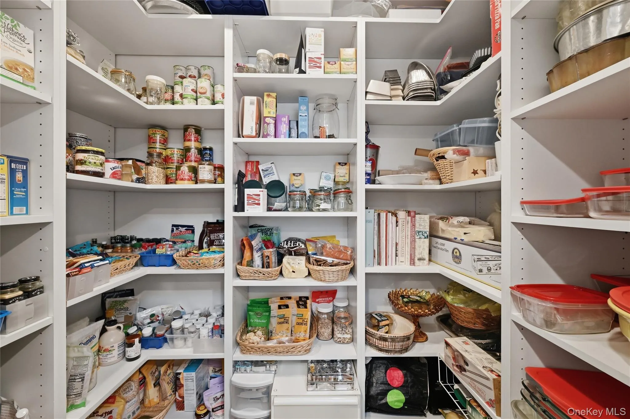 Custom pantry system featuring white shelving Custom pantry system featuring white shelving