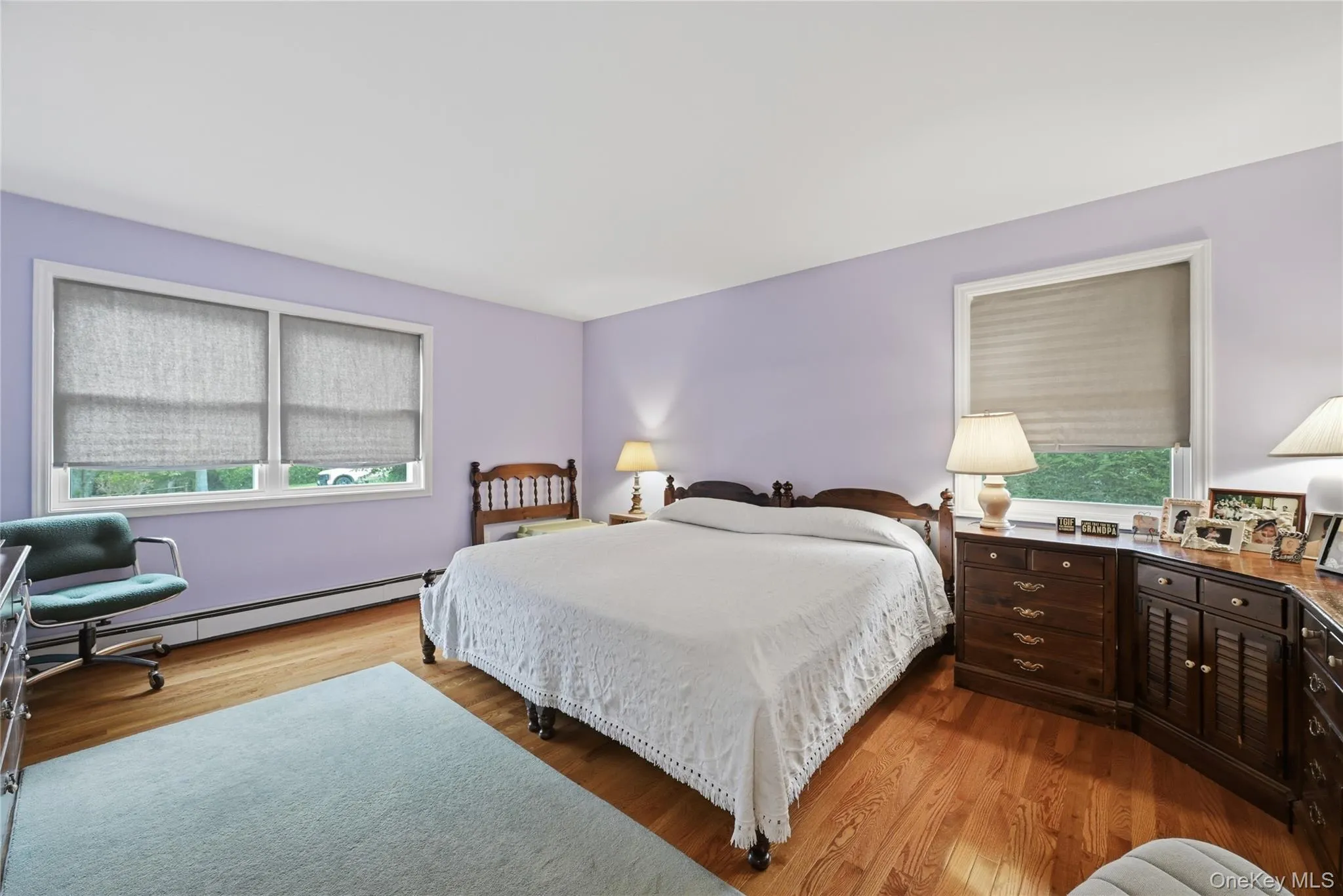 Wood-finish flooring with light purple walls Wood-finish flooring with light purple walls