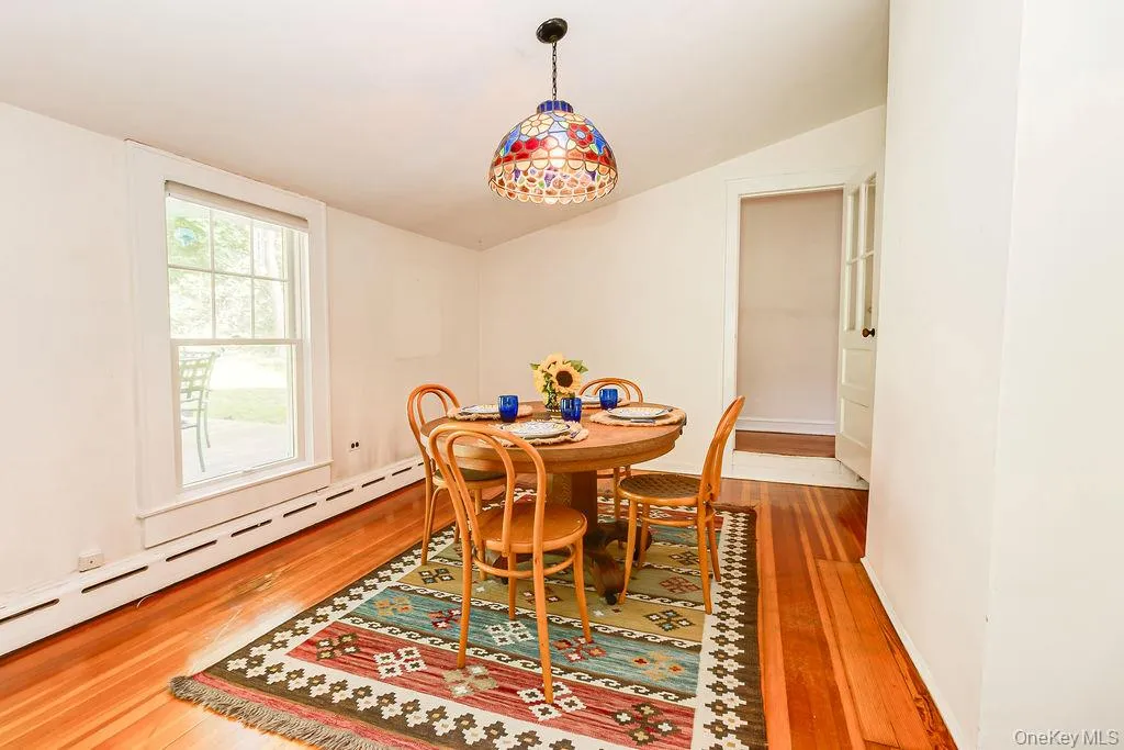 Bright & airy dining room with hardwood floors Bright & airy dining room with hardwood floors
