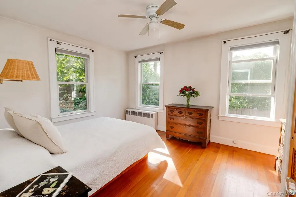 Sunny bedroom with hardwood floors Sunny bedroom with hardwood floors