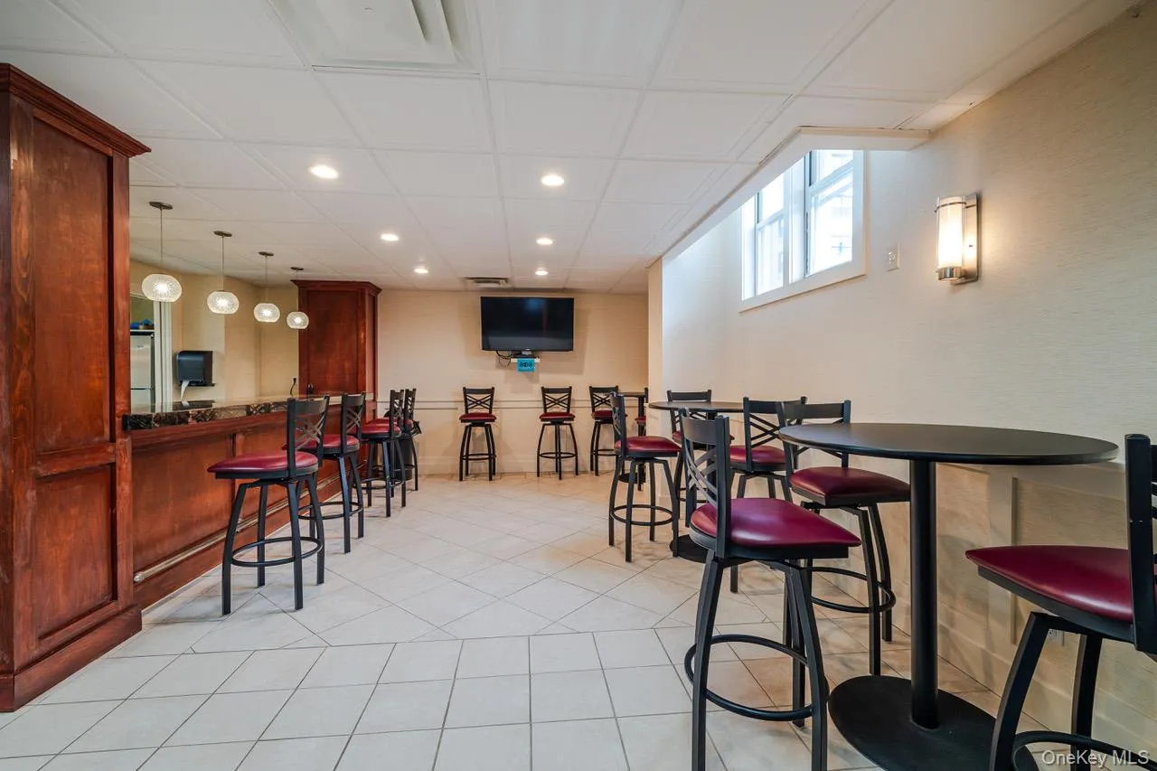Party room with kitchen, bar, pub seating and banquet tables. Party room with kitchen, bar, pub seating and banquet tables.