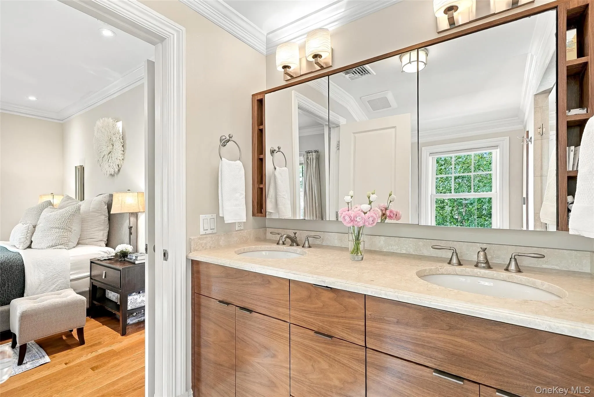 Primary Ensuite Bath with double vanity, large shower, linen closet and treetop views Primary Ensuite Bath with double vanity, large shower, linen closet and treetop views