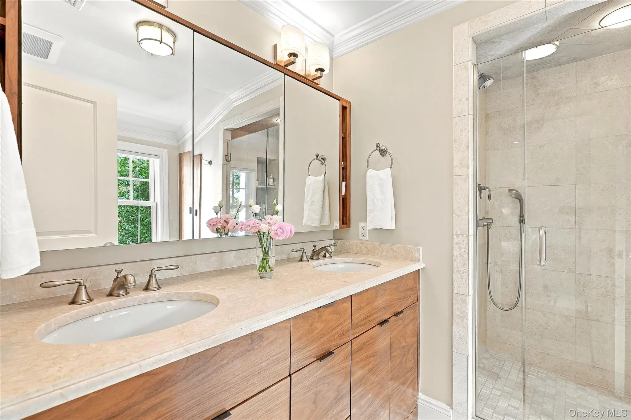 Primary Ensuite Bath with double vanity, large shower, linen closet and treetop views Primary Ensuite Bath with double vanity, large shower, linen closet and treetop views