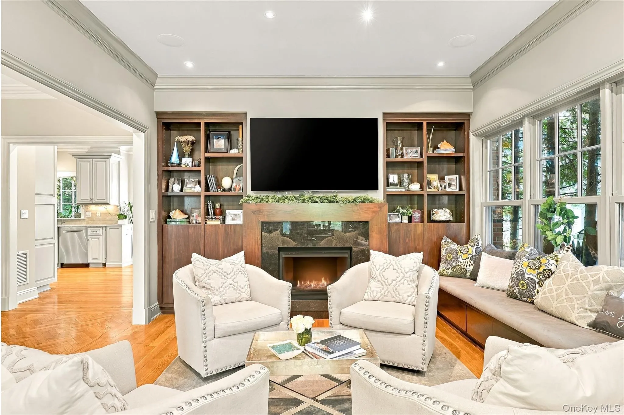 Living Room with gas fireplace, built-in cabinetry & window seat Living Room with gas fireplace, built-in cabinetry & window seat