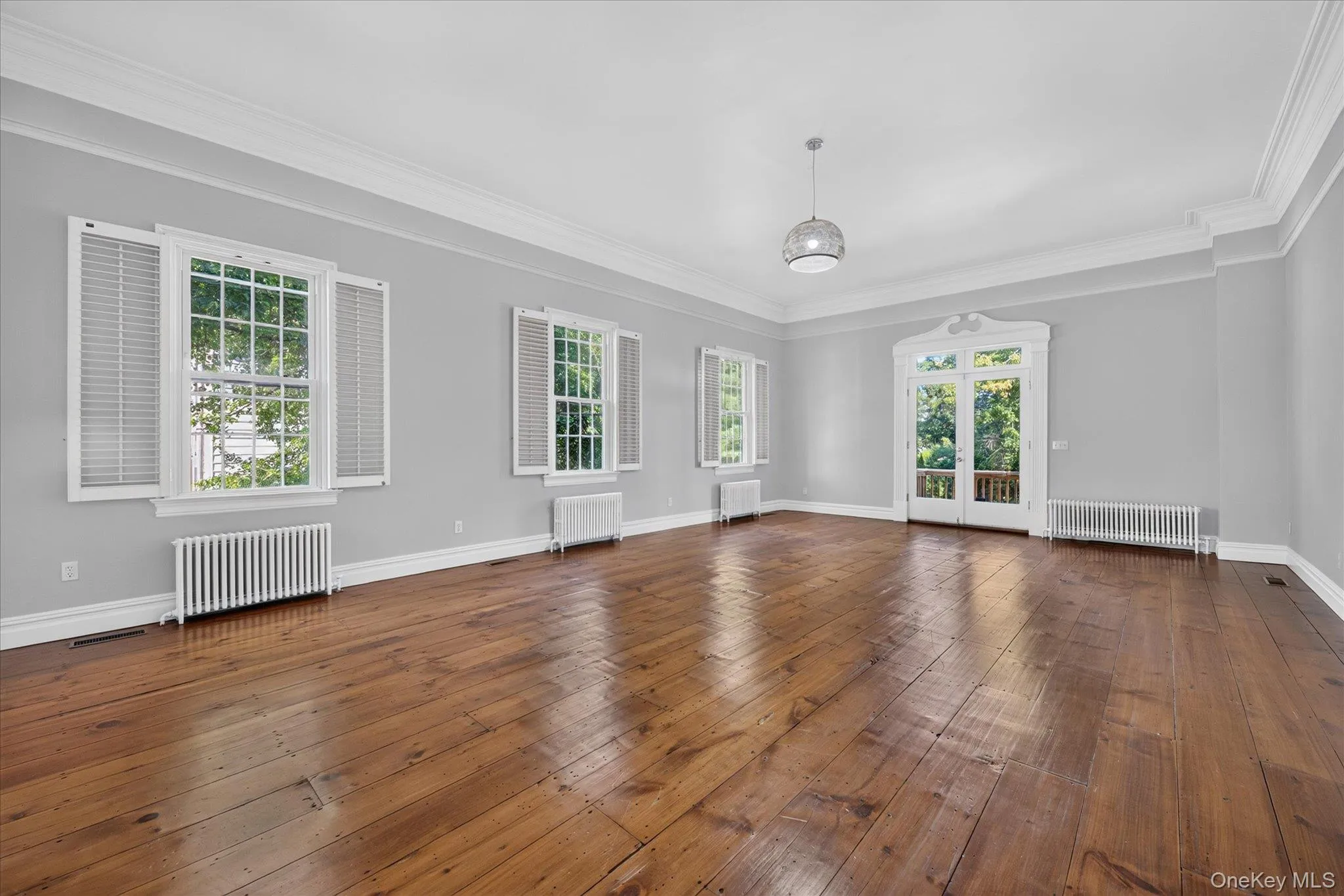 Plenty of room for a living / dining room combo. Original wide plank wood flooring Plenty of room for a living / dining room combo. Original wide plank wood flooring