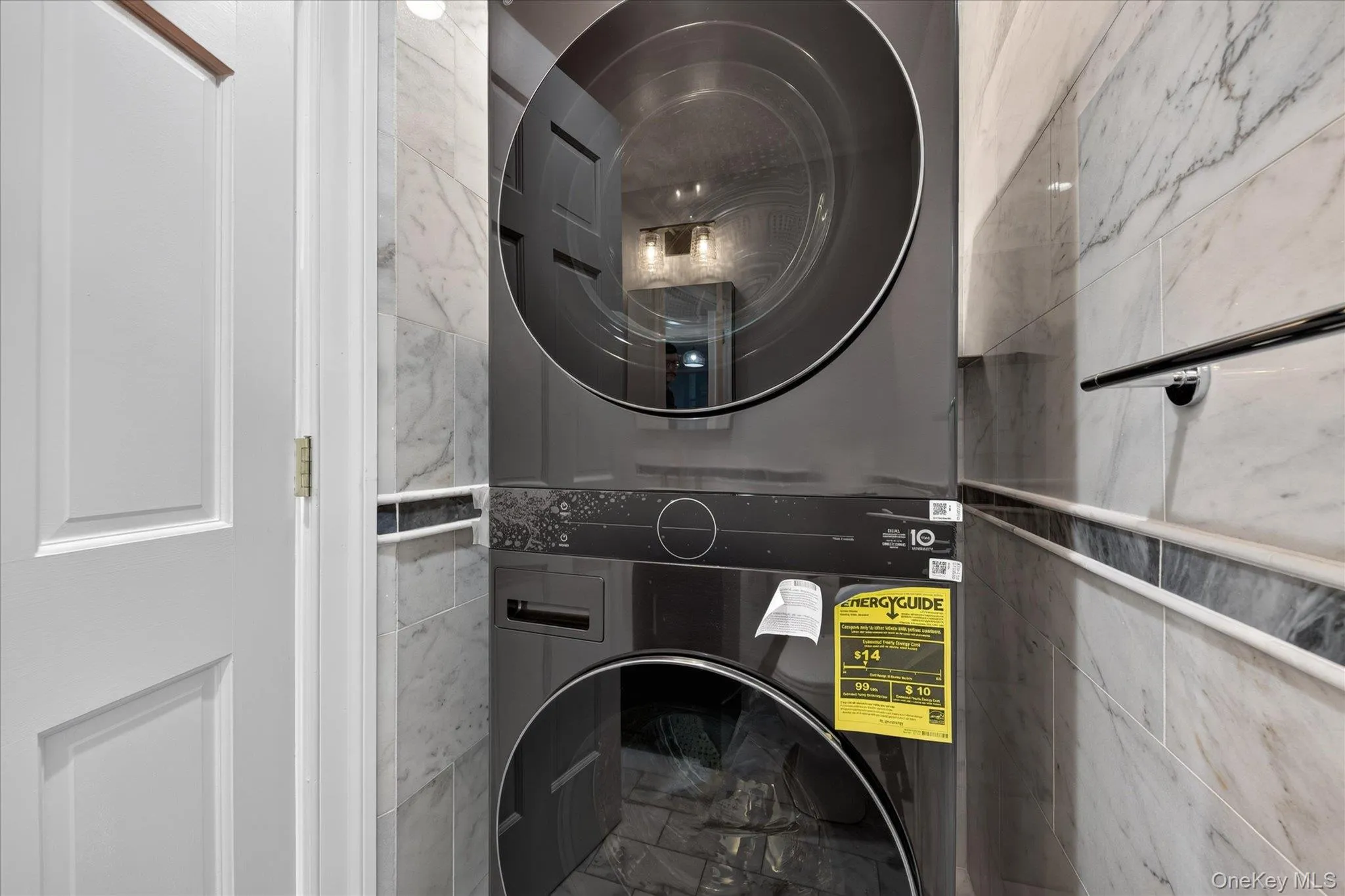 Half bathroom with electric washer/dryer on first floor Half bathroom with electric washer/dryer on first floor