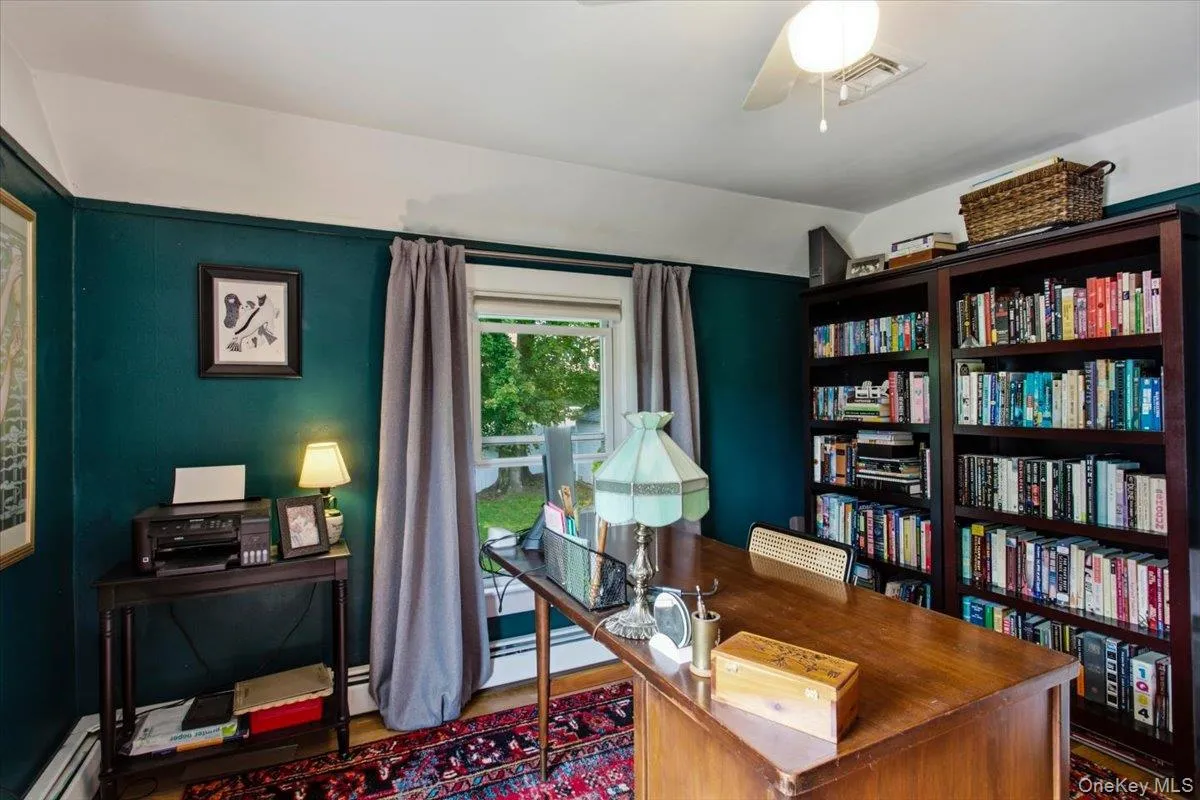 Upstairs, the third bedroom is being used as a formal office. Upstairs, the third bedroom is being used as a formal office.