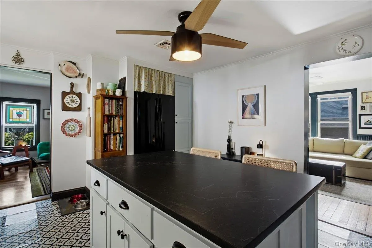 Alternate view of kitchen showing the living room on the opposite side of the wall. Alternate view of kitchen showing the living room on the opposite side of the wall.