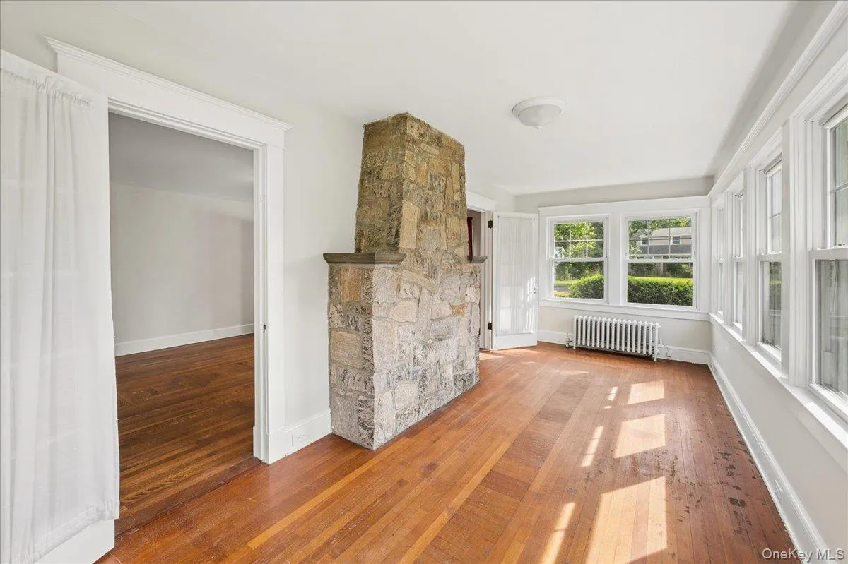 Den off living room with plenty of natural light. Den off living room with plenty of natural light.