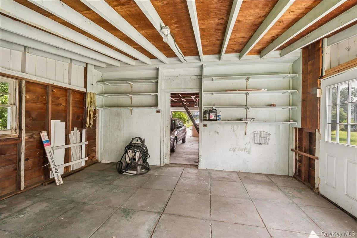 Work room off of the four-car garage. Work room off of the four-car garage.