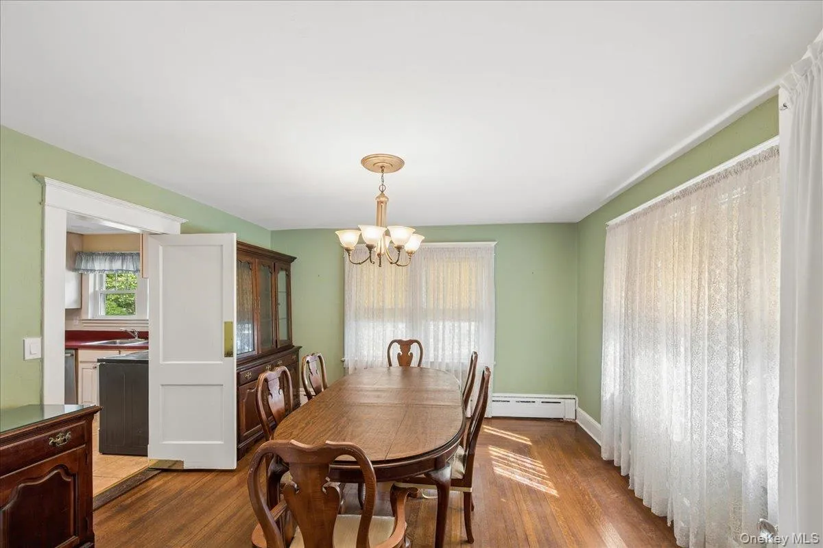 Dining room which leads to the kitchen. Dining room which leads to the kitchen.