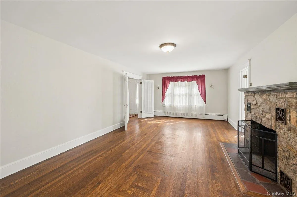 Living room with wood burning fireplace. Living room with wood burning fireplace.