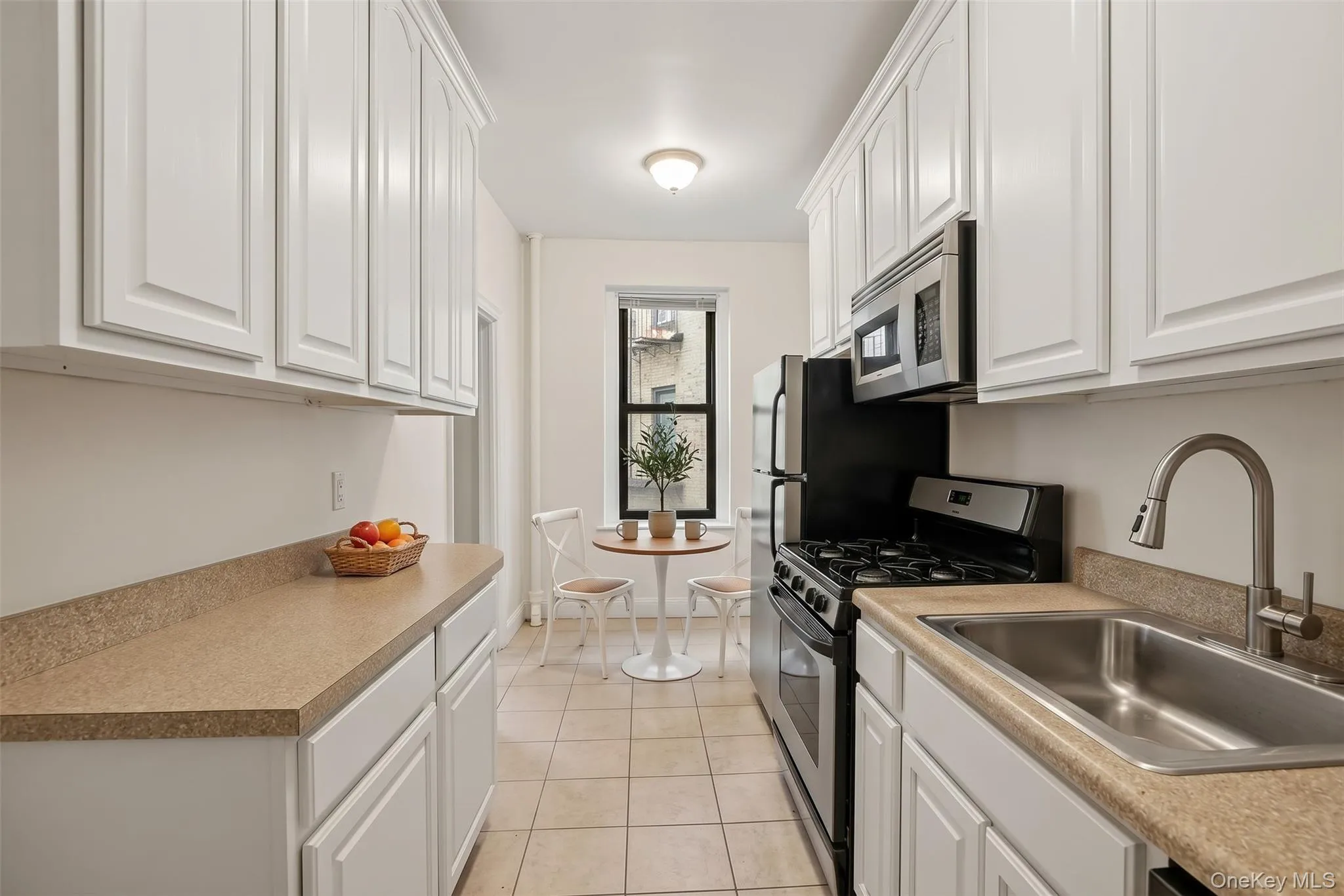 Virtually Staged with painted cabinets and new counters Virtually Staged with painted cabinets and new counters