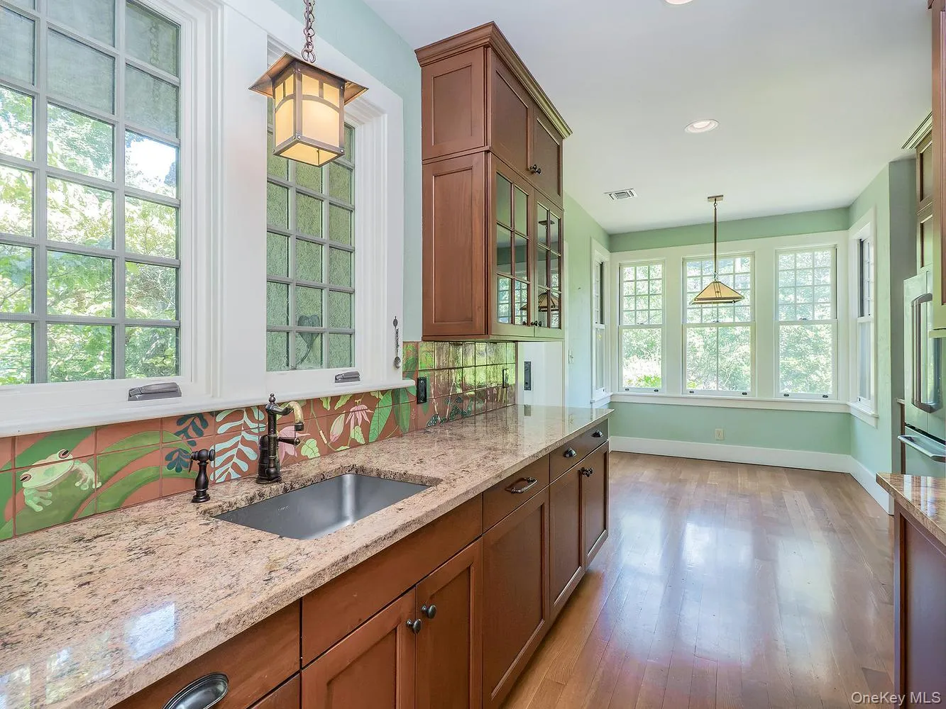 Swing door from dining room leads into kitchen Swing door from dining room leads into kitchen
