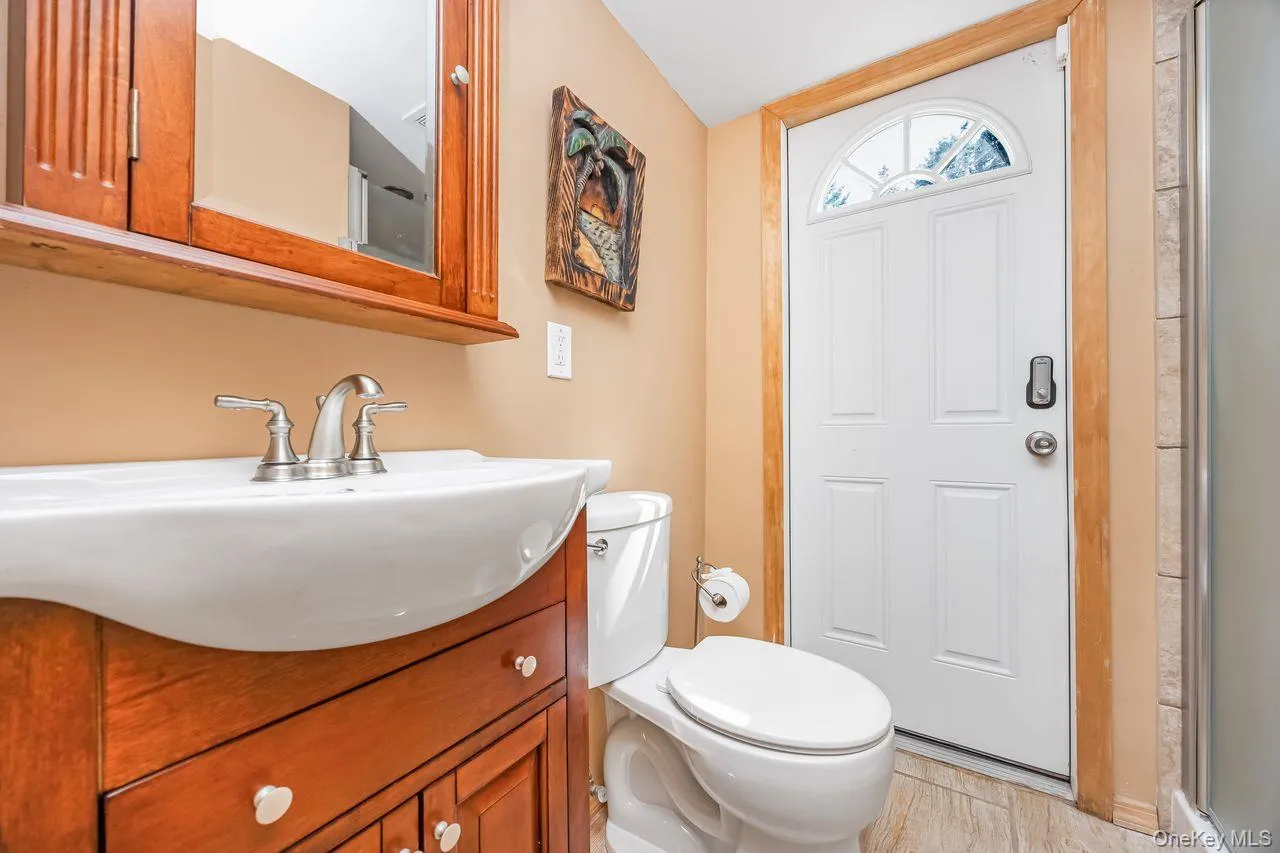 Bathroom with Sauna on walkout level with access door to yard Bathroom with Sauna on walkout level with access door to yard