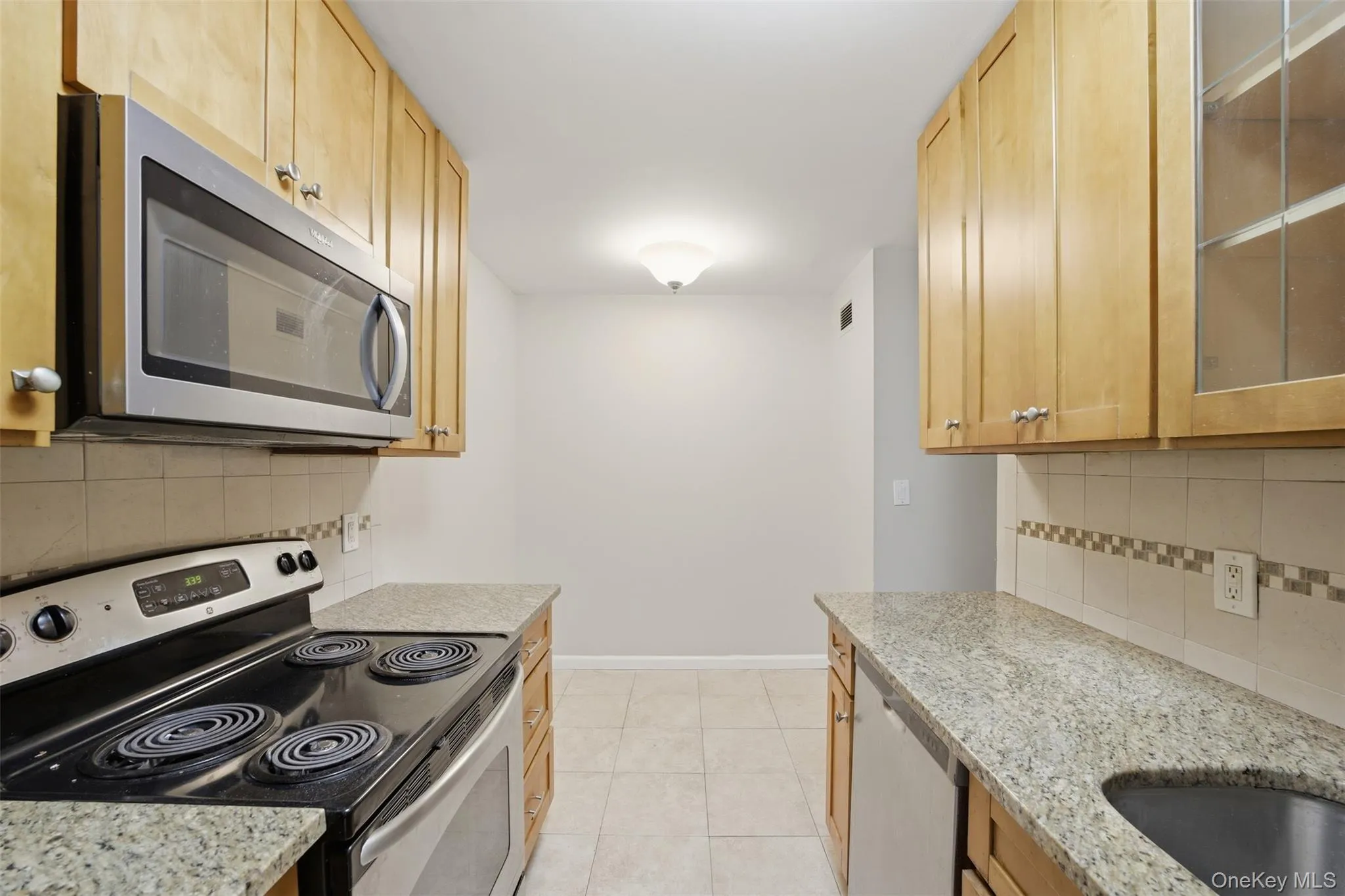 Eat in kitchen with an abundance of cabinet space and stainless steel appliances Eat in kitchen with an abundance of cabinet space and stainless steel appliances