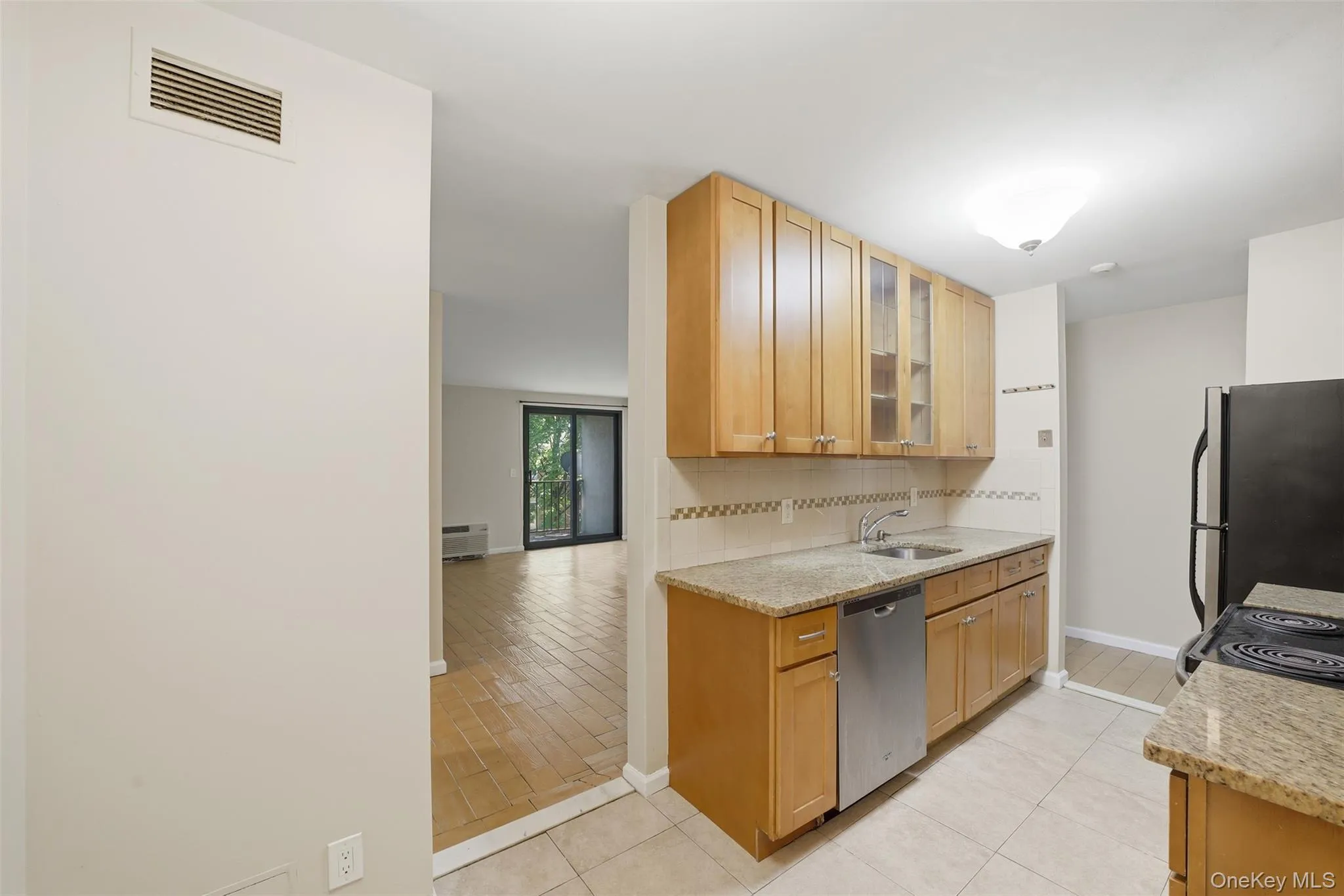 Eat in kitchen leading into dining area and living room with balcony Eat in kitchen leading into dining area and living room with balcony