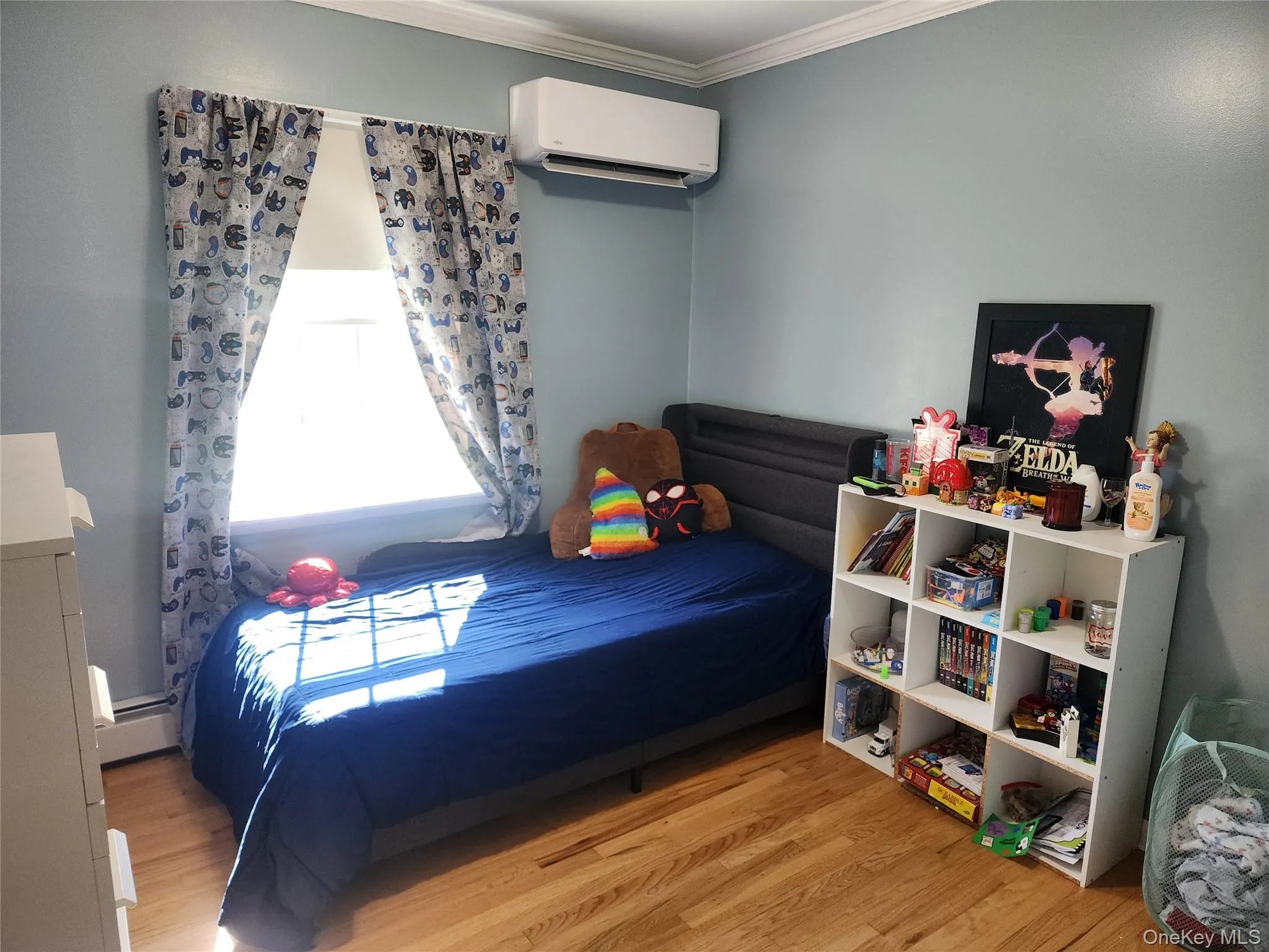 Bedroom with big window, hardwood floors and mini-split Bedroom with big window, hardwood floors and mini-split