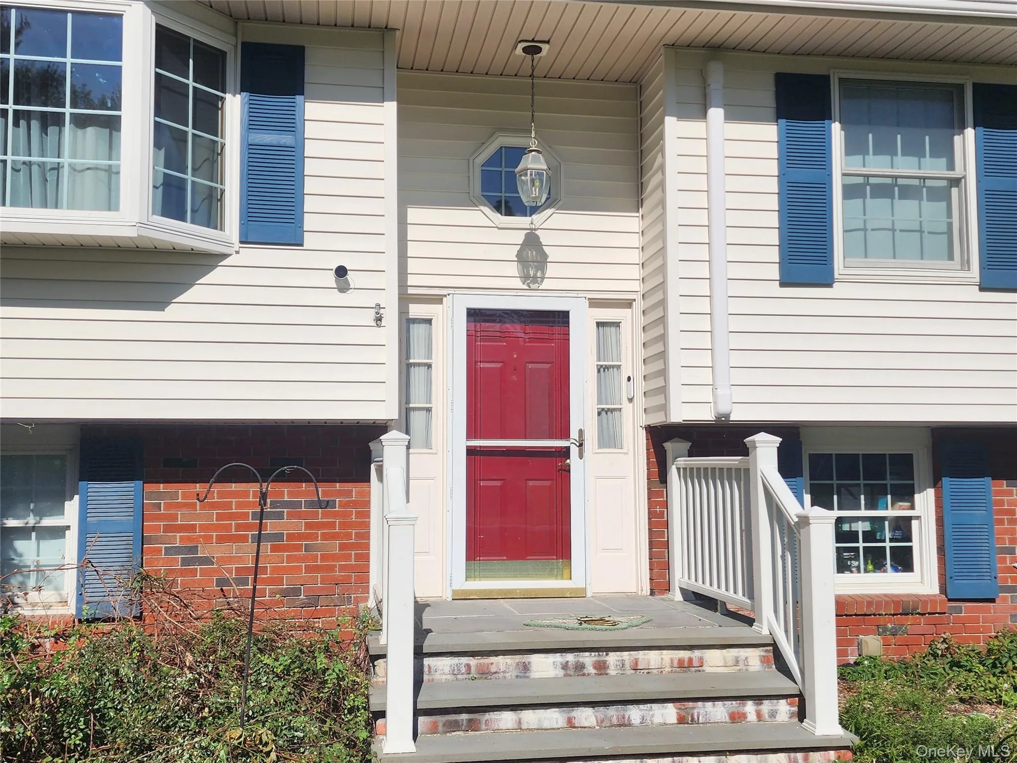 Red entry door with Blue Stone Steps Red entry door with Blue Stone Steps
