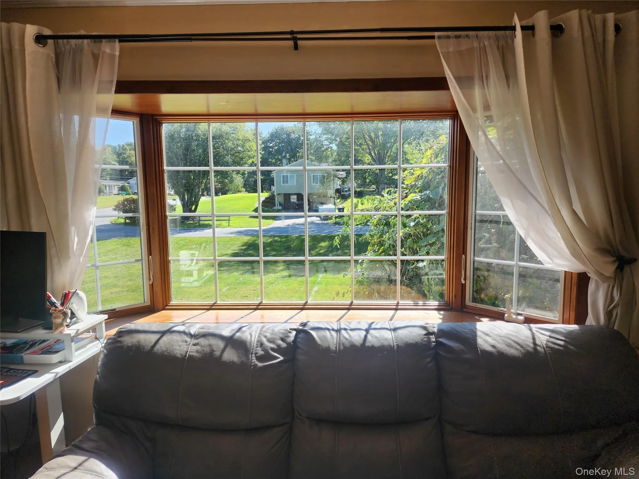 Huge Bay Window in Living Room overlooking front lawn Huge Bay Window in Living Room overlooking front lawn