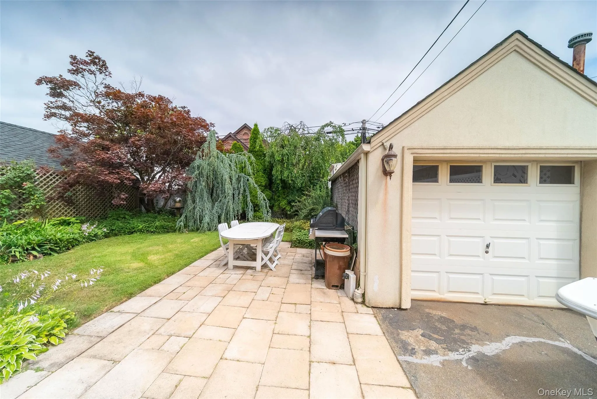 Detached garage with asphalt driveway Detached garage with asphalt driveway
