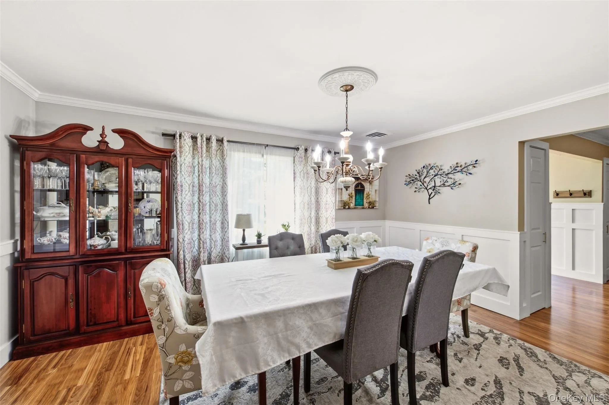 Wood-finish flooring with crown molding and wainscoting Wood-finish flooring with crown molding and wainscoting