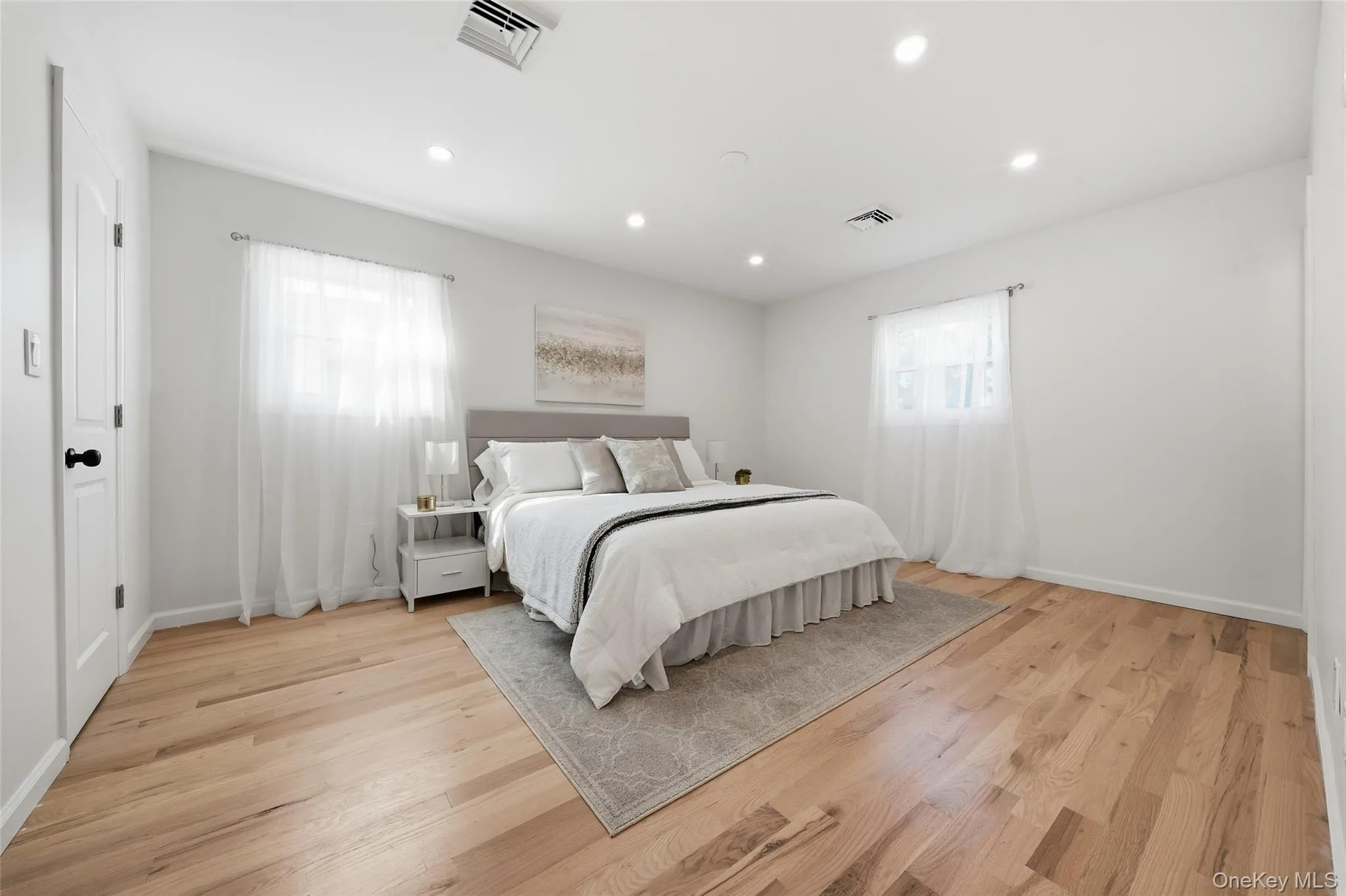 Premier Bedroom,Recessed lighting illuminating wood-finish flooring Premier Bedroom,Recessed lighting illuminating wood-finish flooring