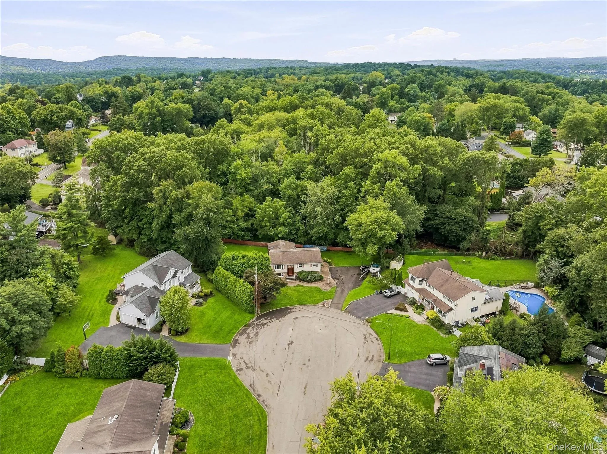 Cul-de-sac location with a private backyard, manicured lawn, and mature tree landscaping Cul-de-sac location with a private backyard, manicured lawn, and mature tree landscaping