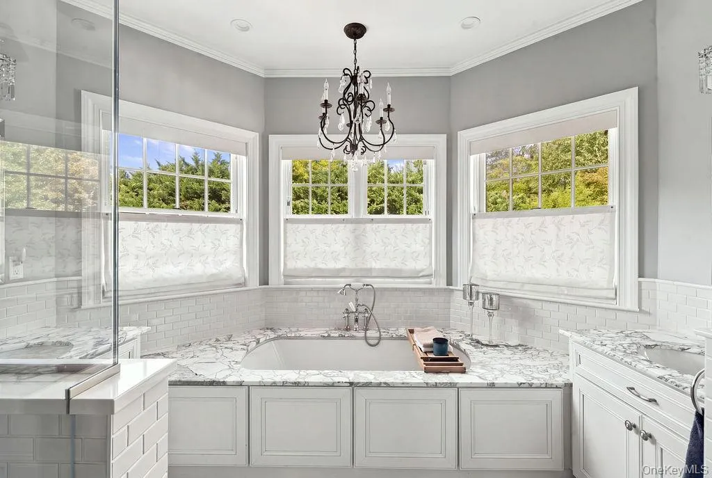 Whirlpool tub and 2 separate vanities with marble countertops Whirlpool tub and 2 separate vanities with marble countertops