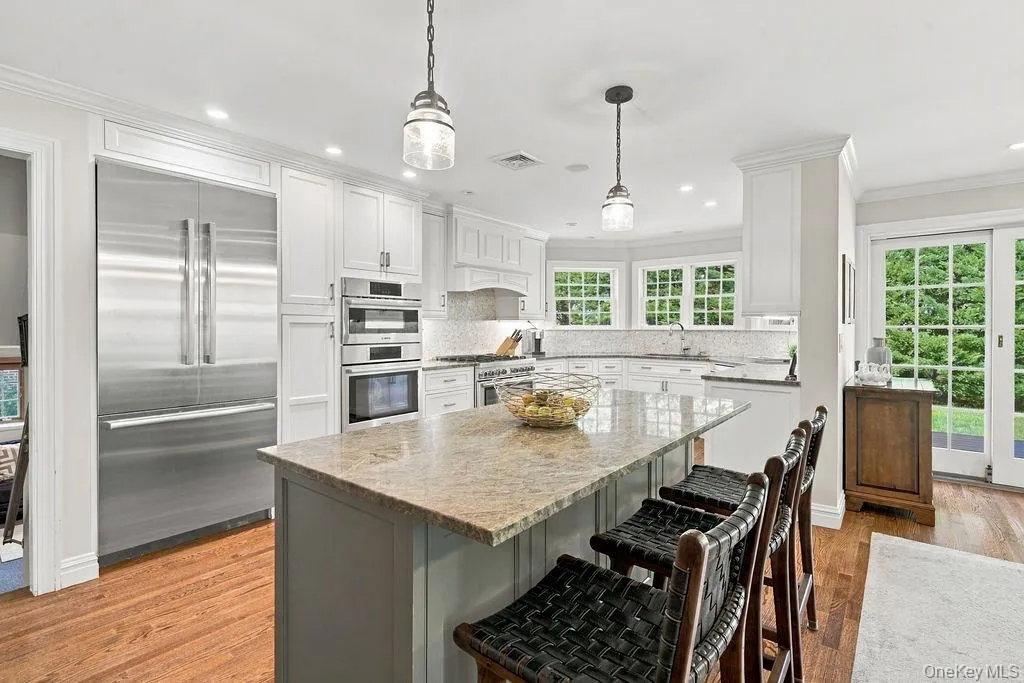 Large center island with wine fridge Large center island with wine fridge