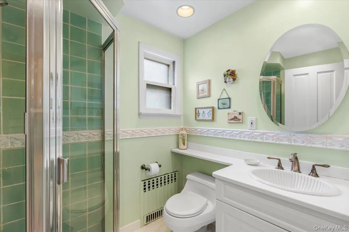 First floor full bathroom with stall shower. First floor full bathroom with stall shower.