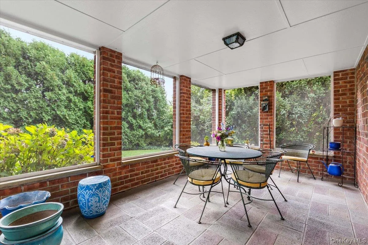 Screened-in outdoor porch. Screened-in outdoor porch.