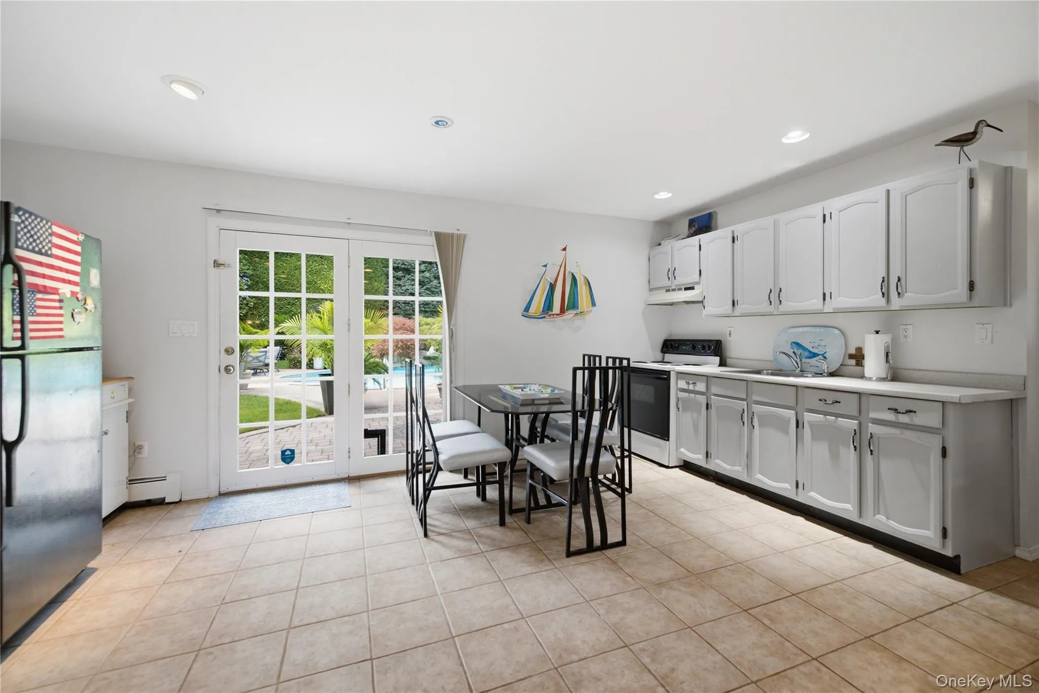 HUGE kitchen on garden level with ceramic tile floors and slider to outdoor oasis HUGE kitchen on garden level with ceramic tile floors and slider to outdoor oasis