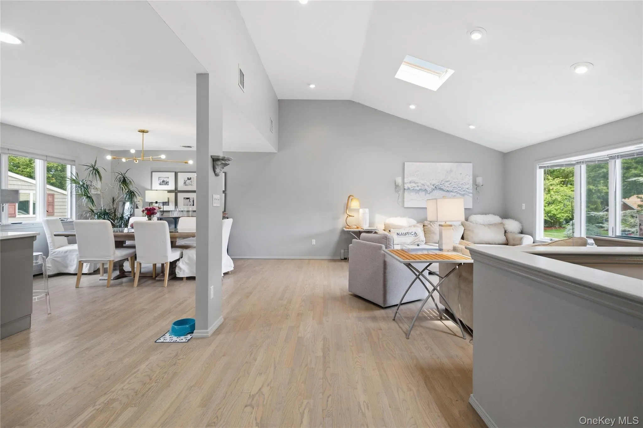 Enormous open layout great room with driftwood floors Enormous open layout great room with driftwood floors