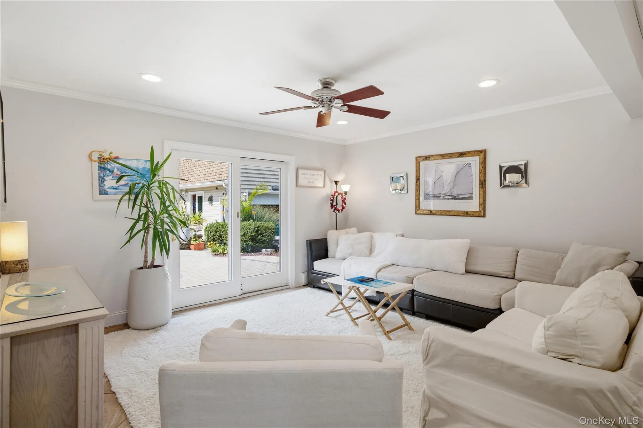 Family room with sliders to the outdoor oasis Family room with sliders to the outdoor oasis