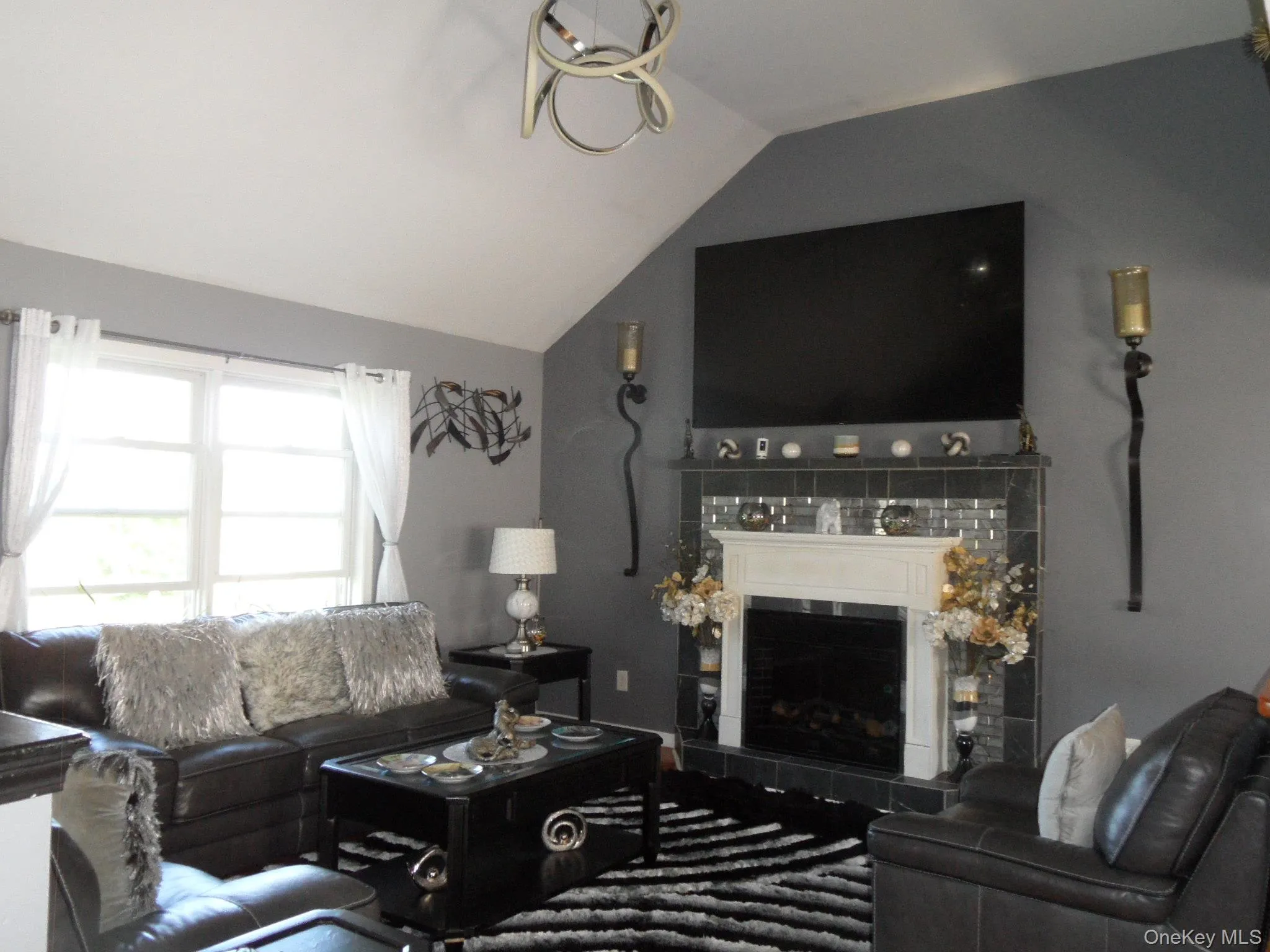 Living Room w. Electric Fireplace & wood flooring Living Room w. Electric Fireplace & wood flooring