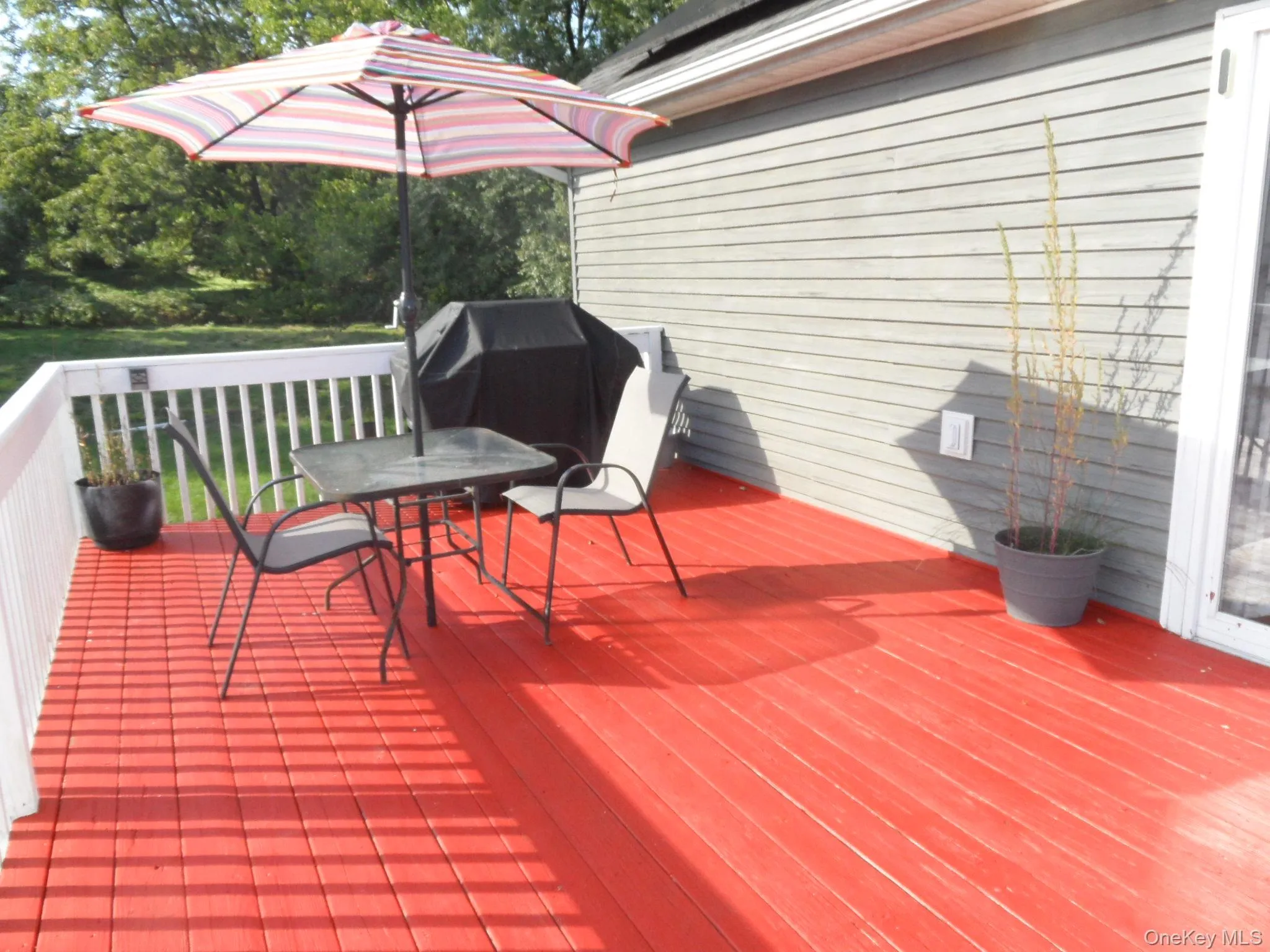 Rear Deck off Dining Room w. Stairs to yard, patio & driveway Rear Deck off Dining Room w. Stairs to yard, patio & driveway