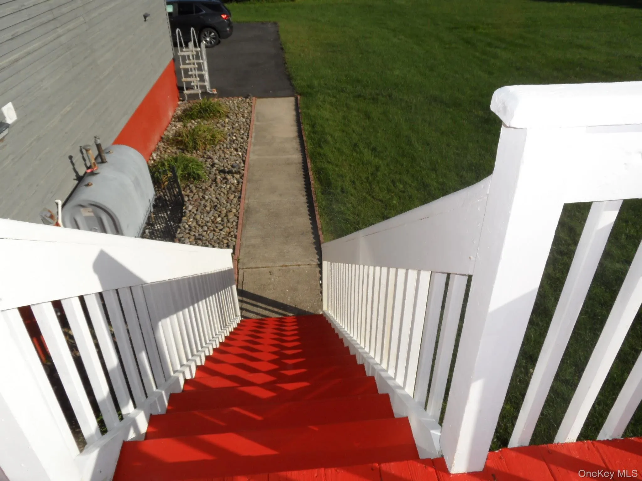 Stairway from deck to yard, patio & driveway Stairway from deck to yard, patio & driveway