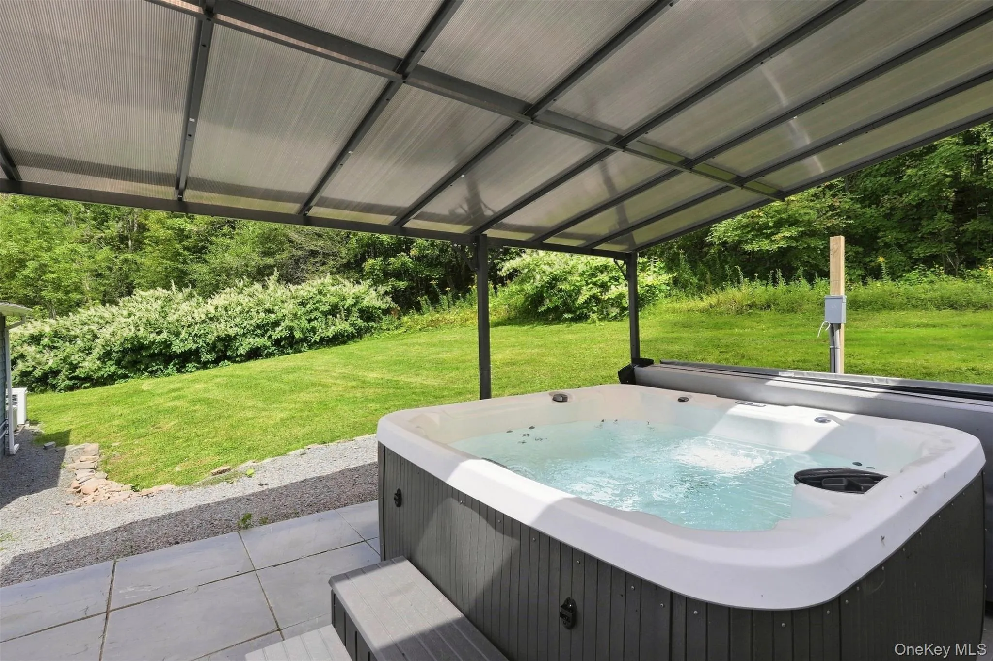 Outdoor hot tub with paver patio Outdoor hot tub with paver patio