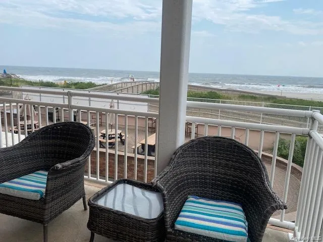 Balcony with a water view and a view of the beach Balcony with a water view and a view of the beach