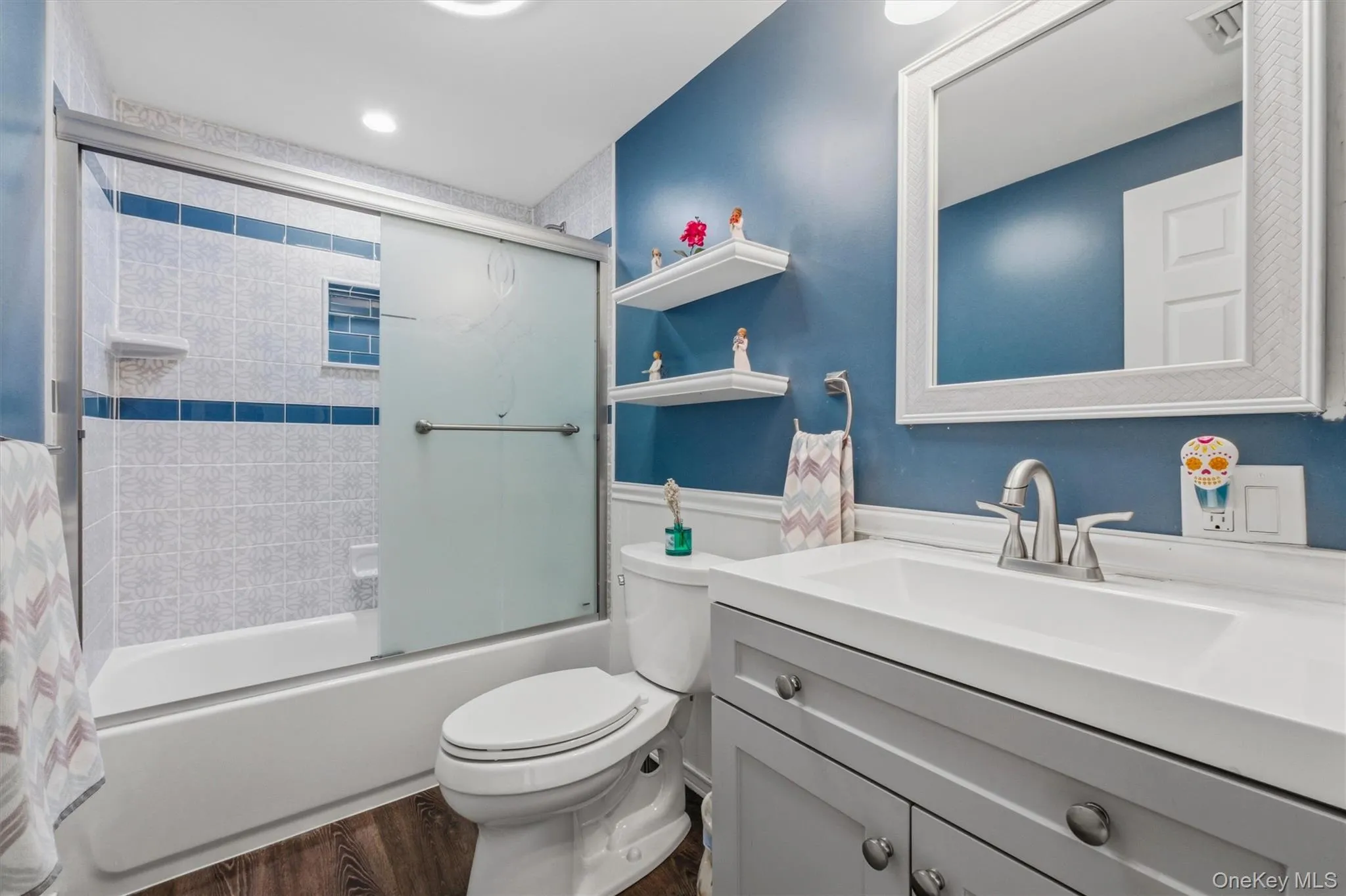 Updated hall bath with tiled shower/tub, laminate flooring. Updated hall bath with tiled shower/tub, laminate flooring.