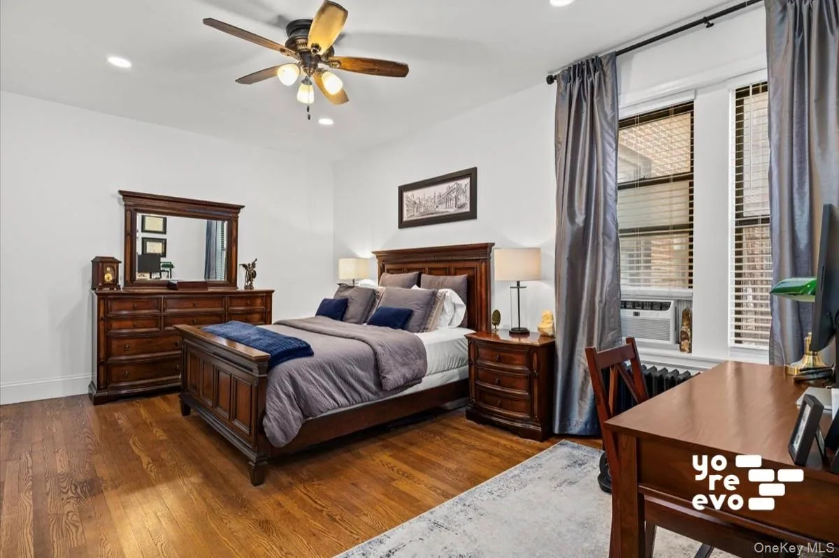 Hardwood flooring, recessed lighting, ceiling fan with integrated lighting, and window blinds Hardwood flooring, recessed lighting, ceiling fan with integrated lighting, and window blinds