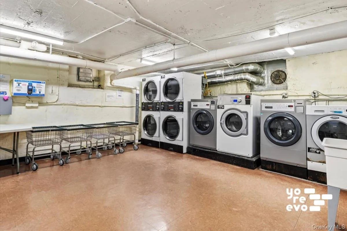Dedicated laundry facility featuring multiple washing machines and dryers Dedicated laundry facility featuring multiple washing machines and dryers