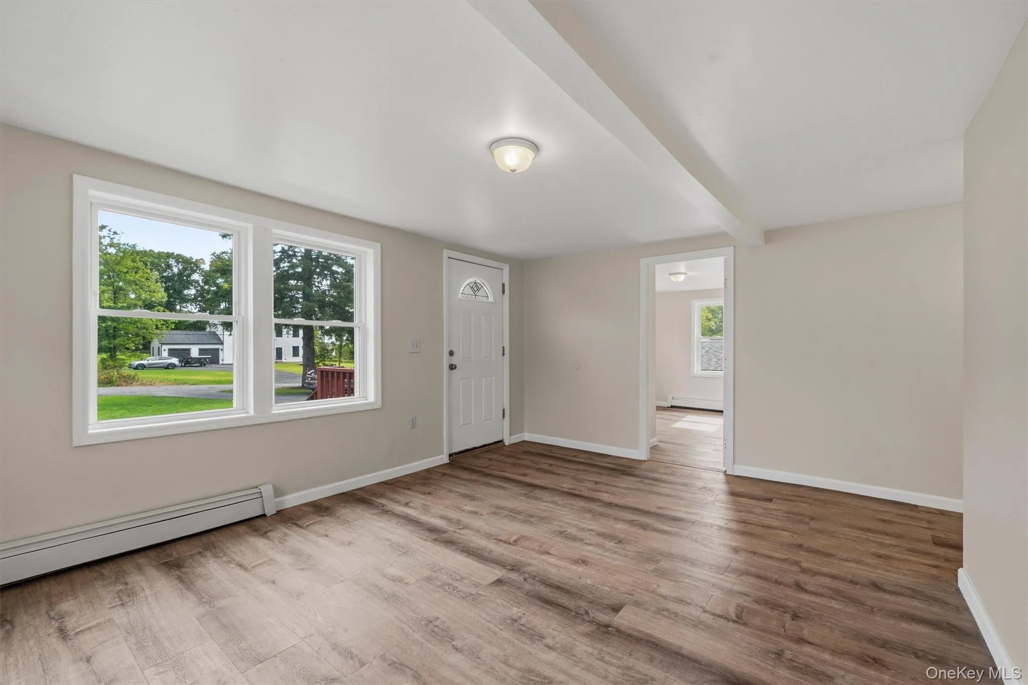 Wood-finish flooring, white trim, and neutral wall tones Wood-finish flooring, white trim, and neutral wall tones