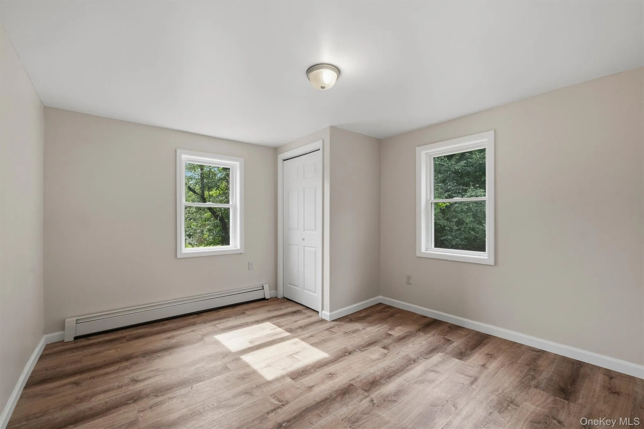 Wood-finish flooring, white trim, and neutral wall tones Wood-finish flooring, white trim, and neutral wall tones