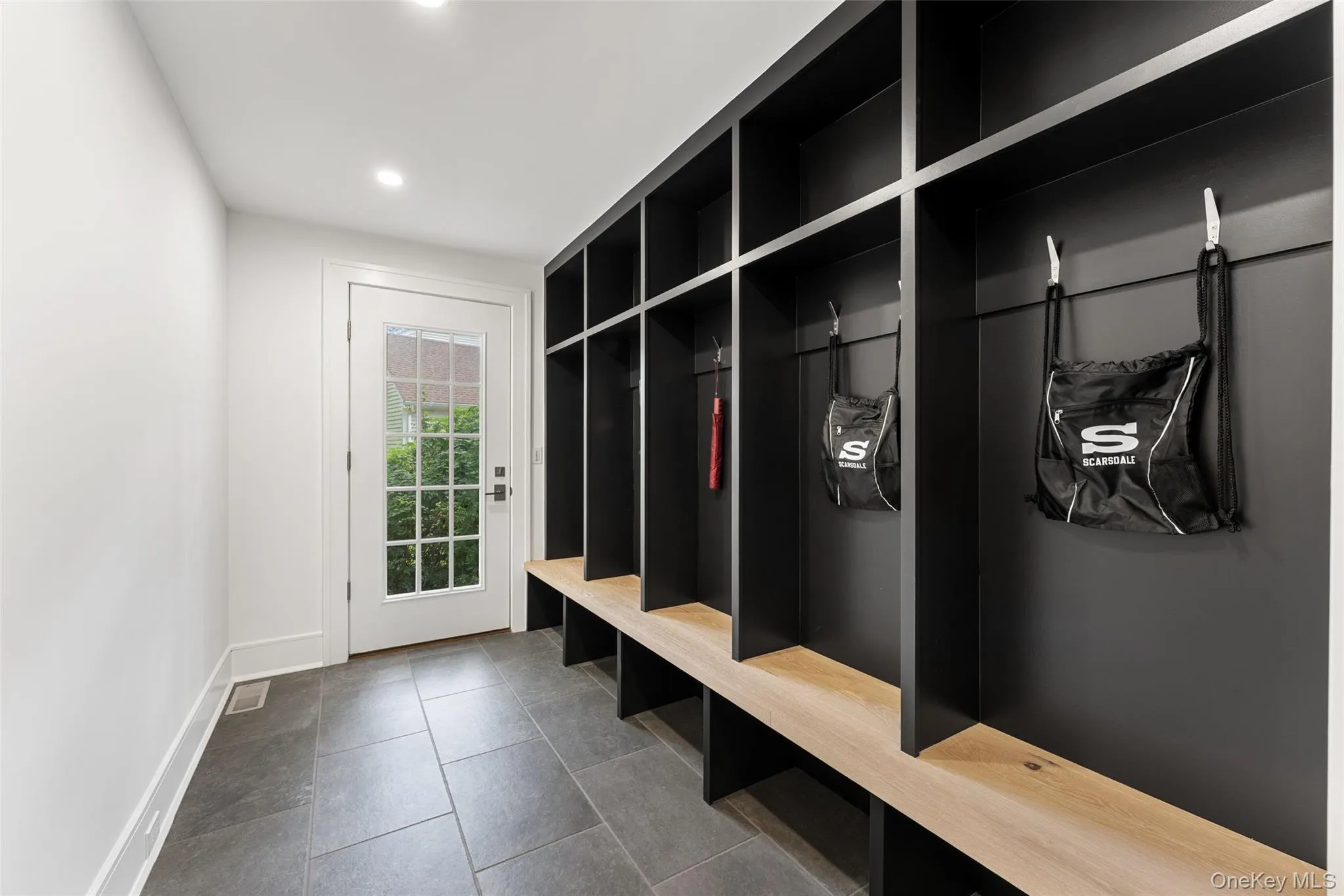 Mudroom with custom cabinetry Mudroom with custom cabinetry
