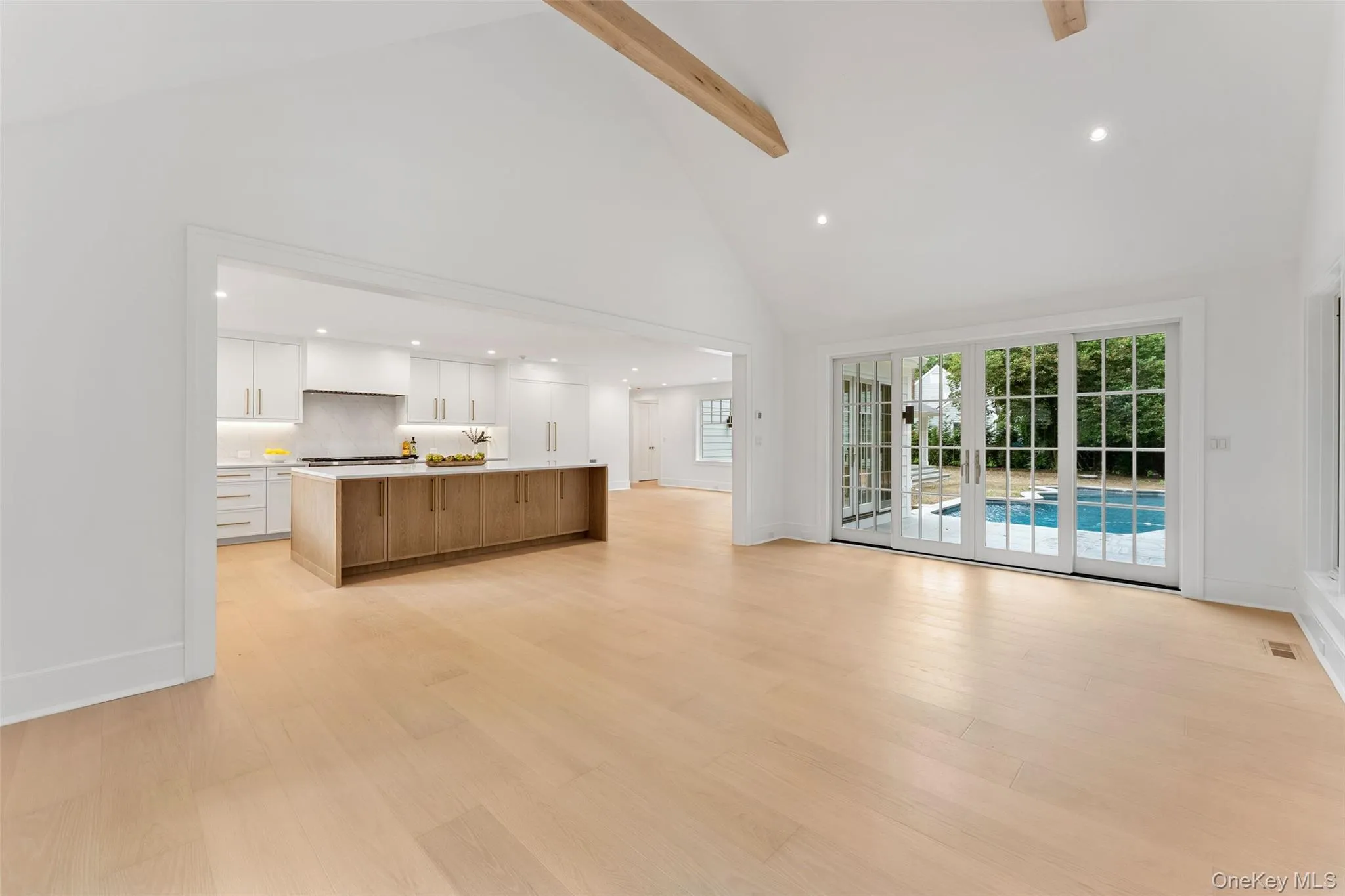 Family room overlooking the kitchen with french doors to the backyard Family room overlooking the kitchen with french doors to the backyard